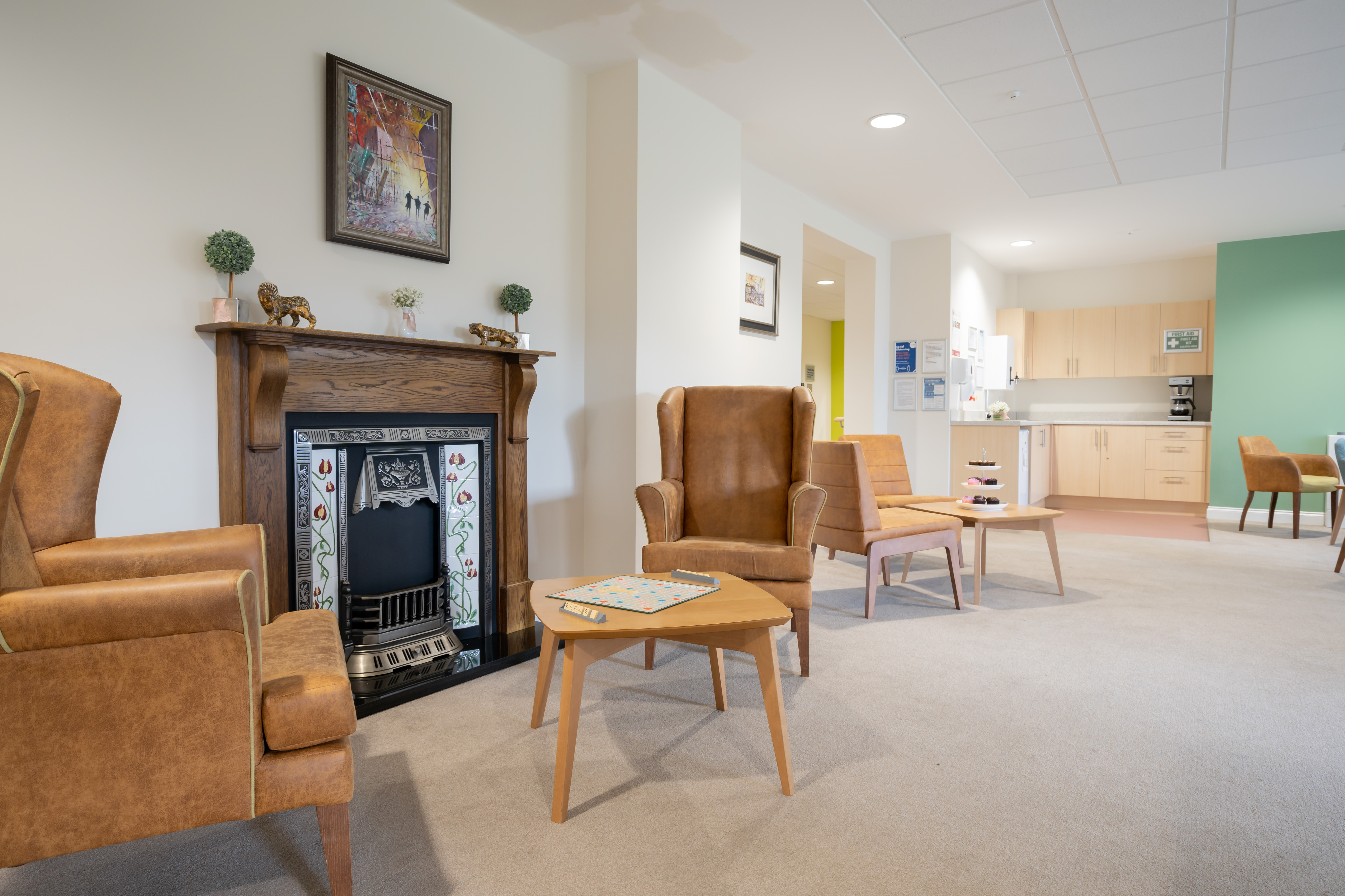 Lounge area with large fireplace to play games at Hope Bank View