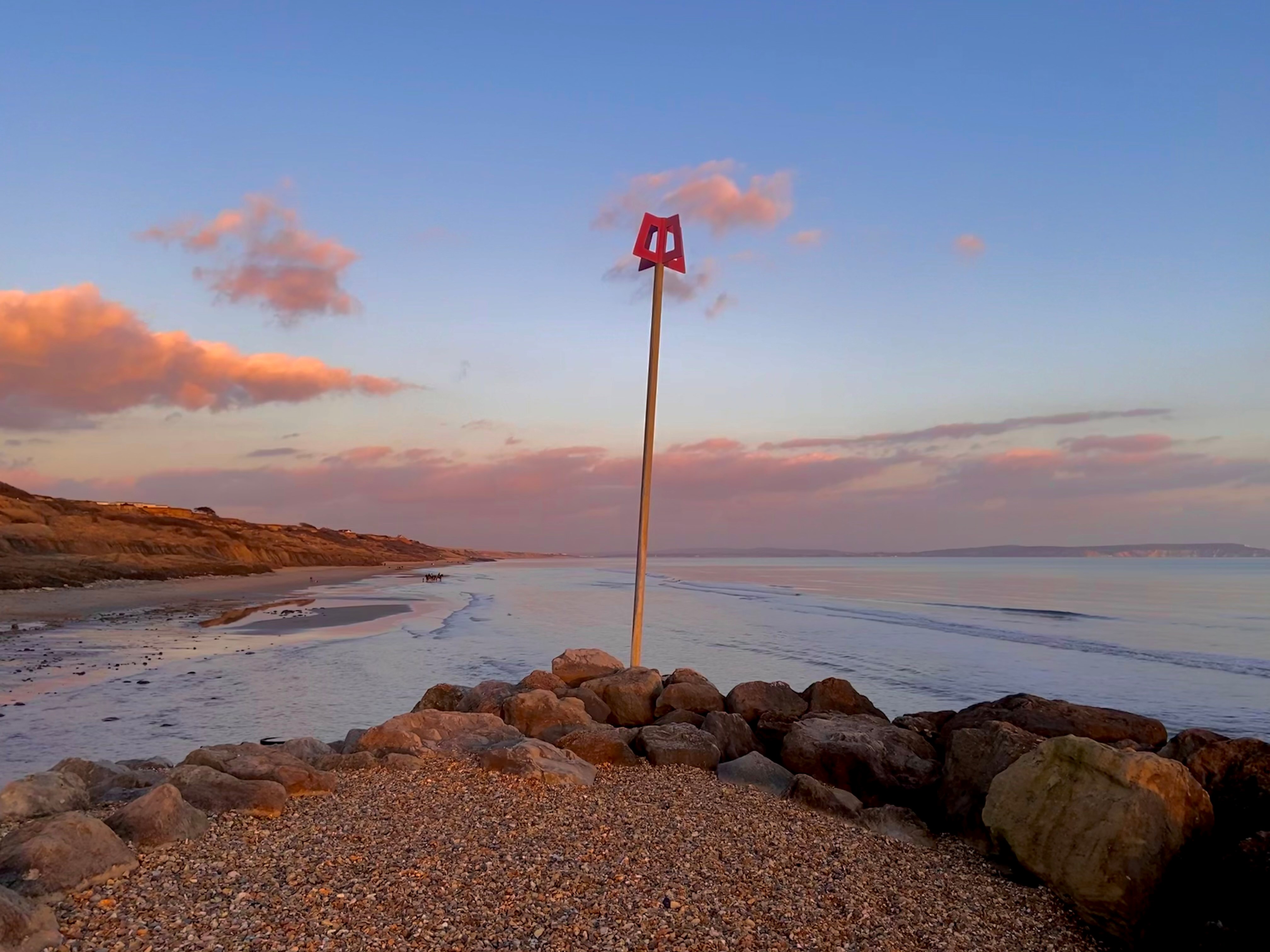 Sun setting on Highcliffe Beach