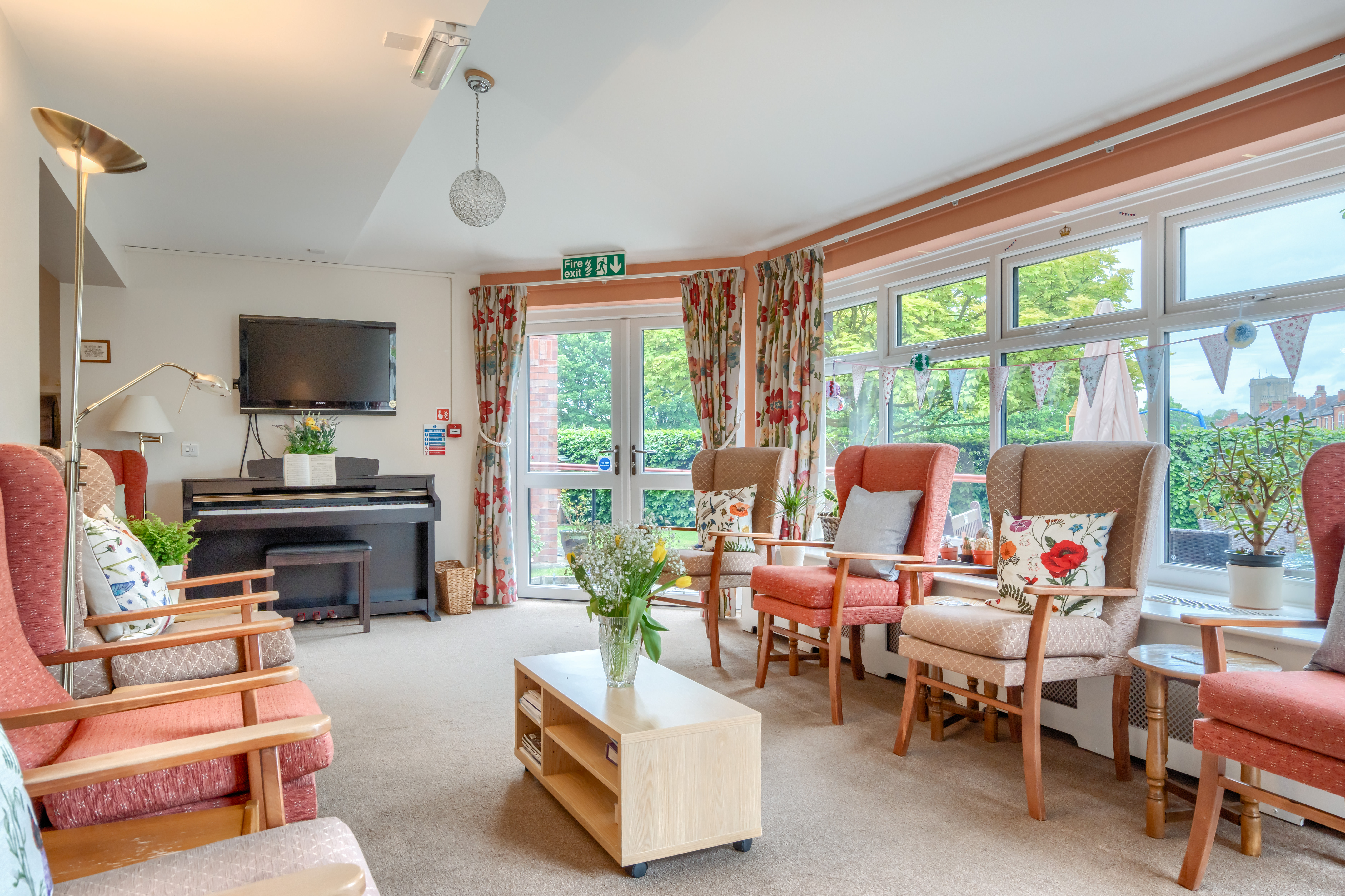 communal-lounge-with-seating-at Abbeyfield House, Lincoln LN1 3HJ (1)