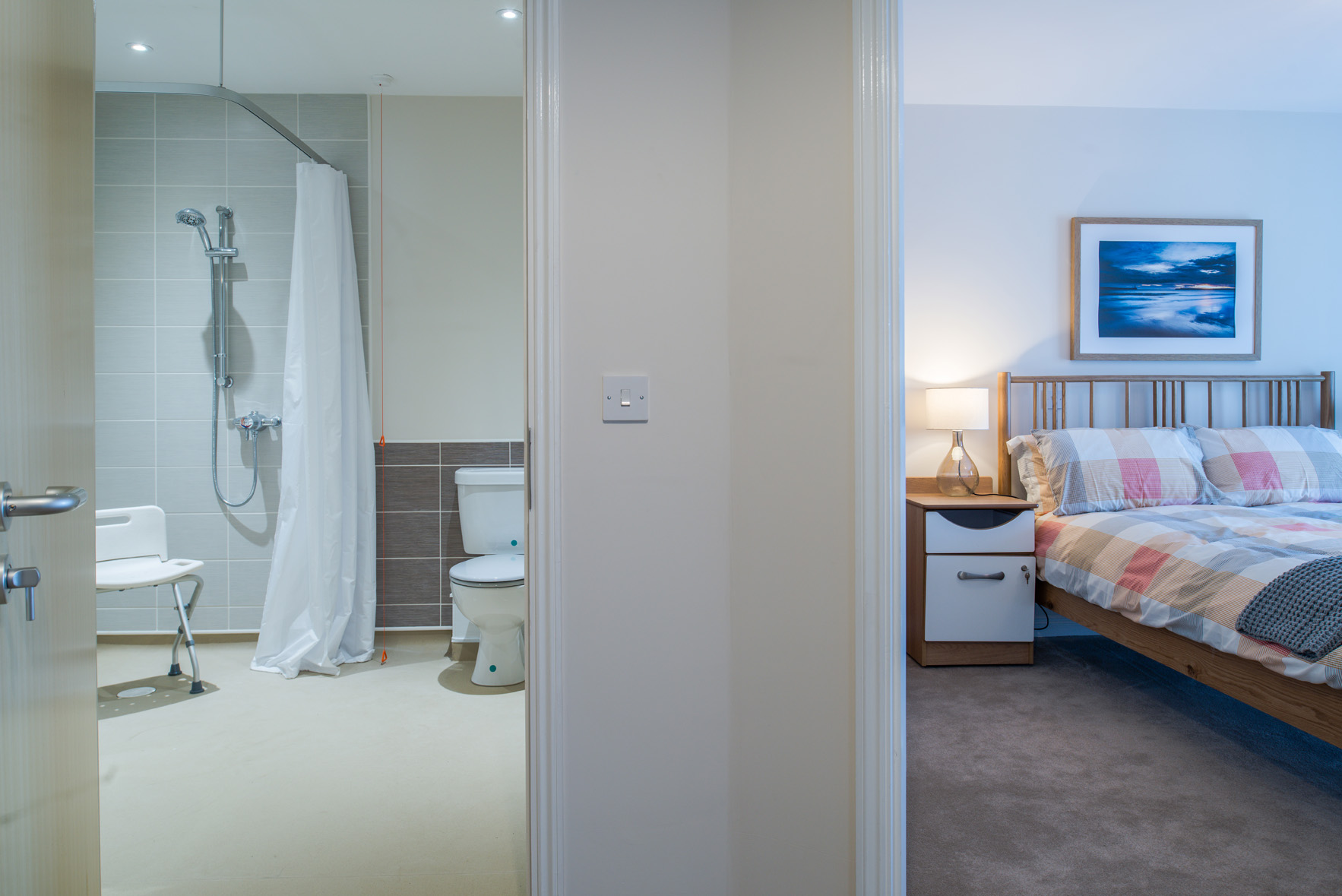 Bedroom and large bathroom with built in shower at Hope Bank View