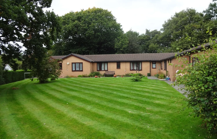 The large well maintained lawn to the rear of the house