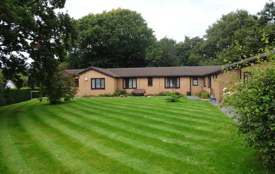 The large well maintained lawn to the rear of the house