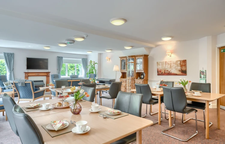 Communal Dining Room With Lounge In Background At Holloway House