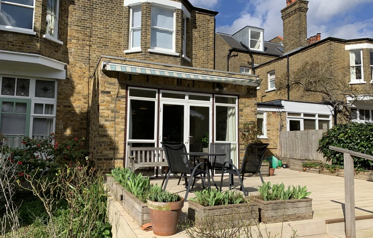 Decking with table and chairs where residents can while away the hours in the sunshine