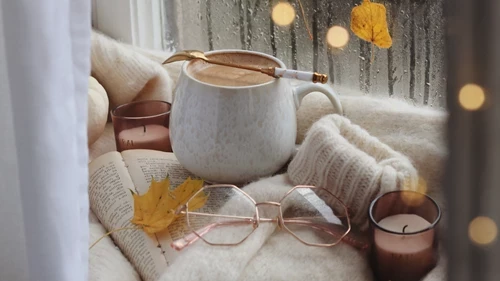 cosy hot drink with glasses and candle