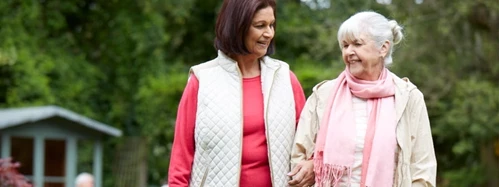 Two ladies walking outside