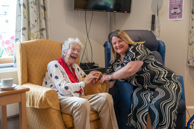 Smiling And Happy Resident And Staff