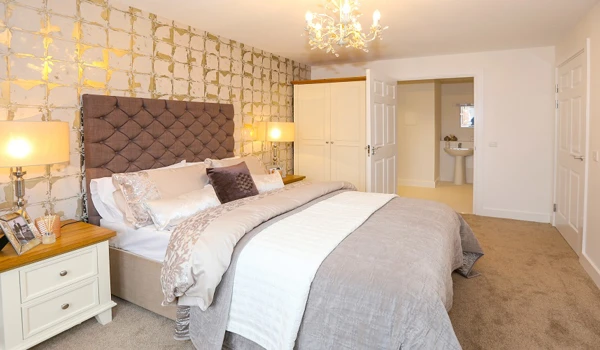 Warmly decorated luxury bedroom with chandelier