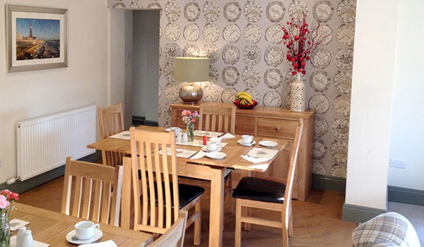 Lounge with tables set for dinner