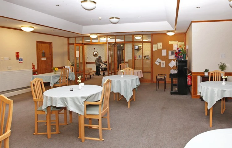 Bright dining area with tables and chairs