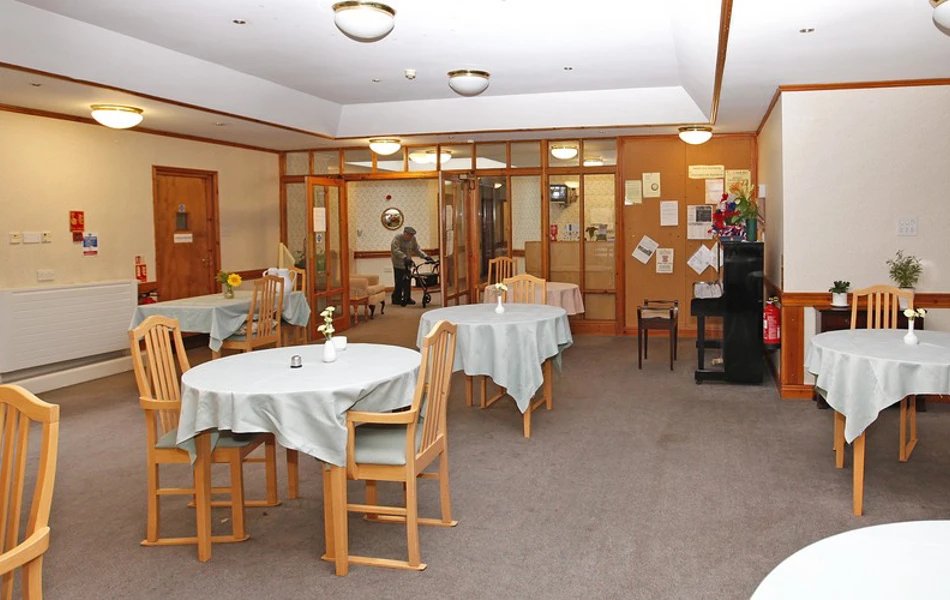 Bright dining area with tables and chairs