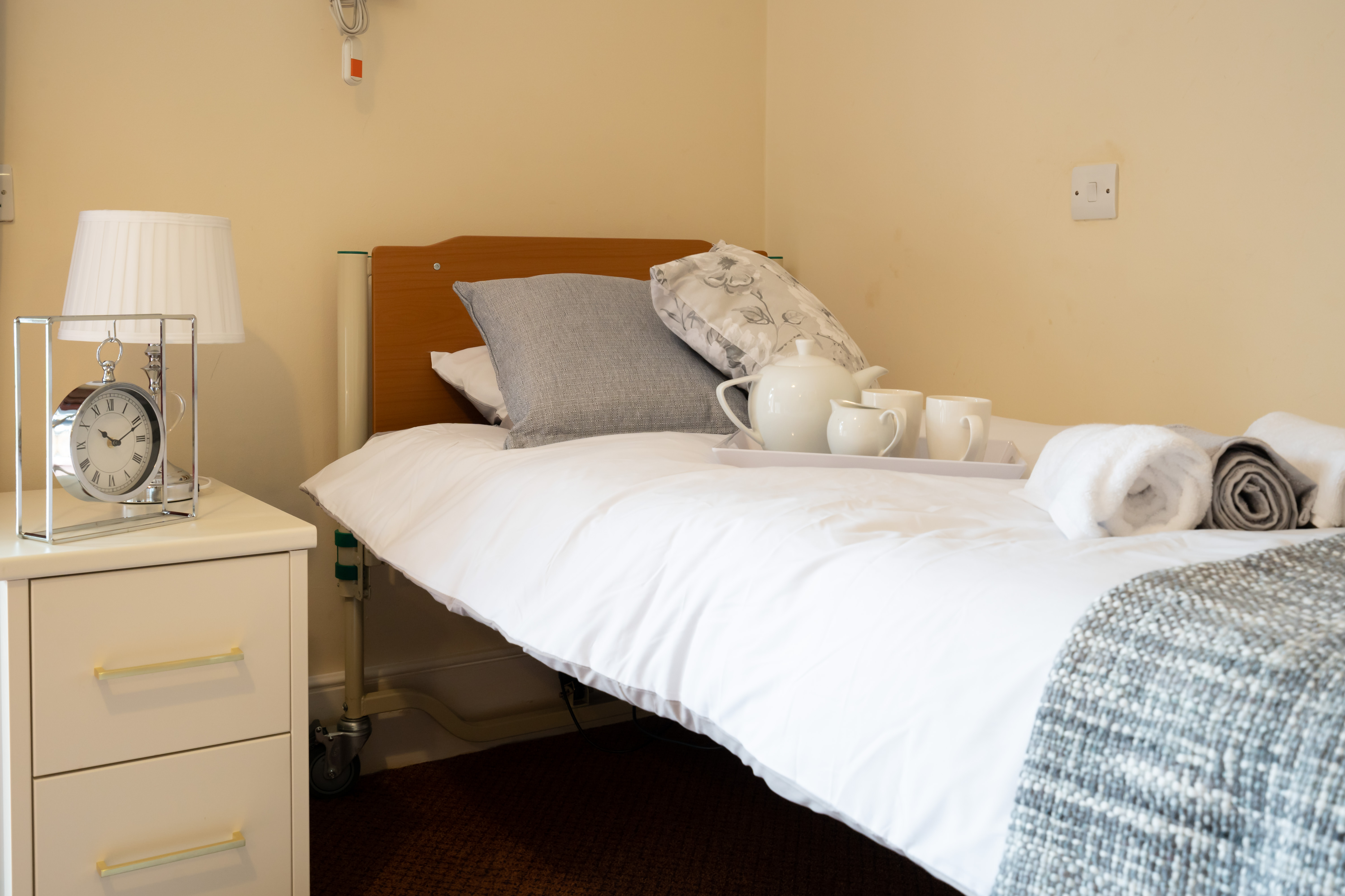 Single bedroom with bedside cabinet and rooms available to rent at Abbeyfield House, New Malden