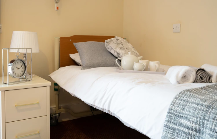 Single bedroom with bedside cabinet and rooms available to rent at Abbeyfield House, New Malden