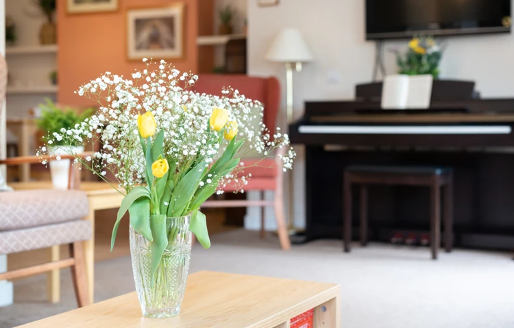 fresh-flowers-on-the-coffee-table-in-lounge at Abbeyfield House, Lincoln LN1 3HJ (1)