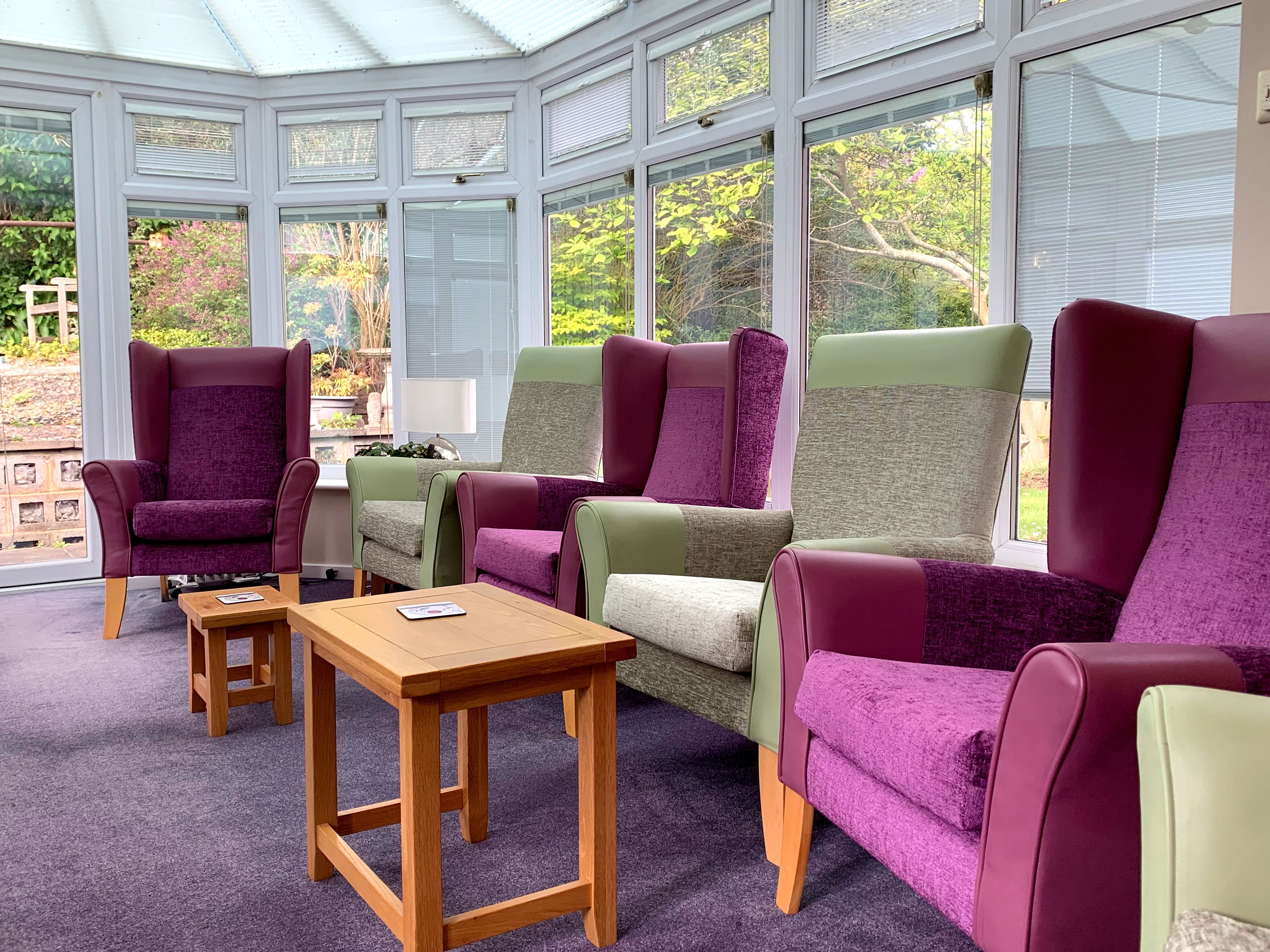 Conservatory at Garrad House overlooking the garden where residents can relax and enjoy socialising