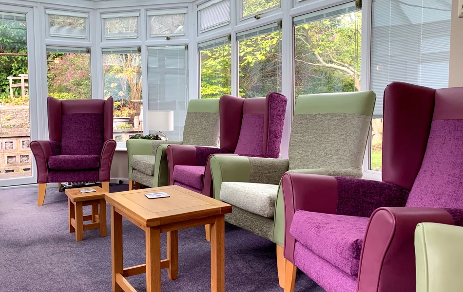 Conservatory at Garrad House overlooking the garden where residents can relax and enjoy socialising