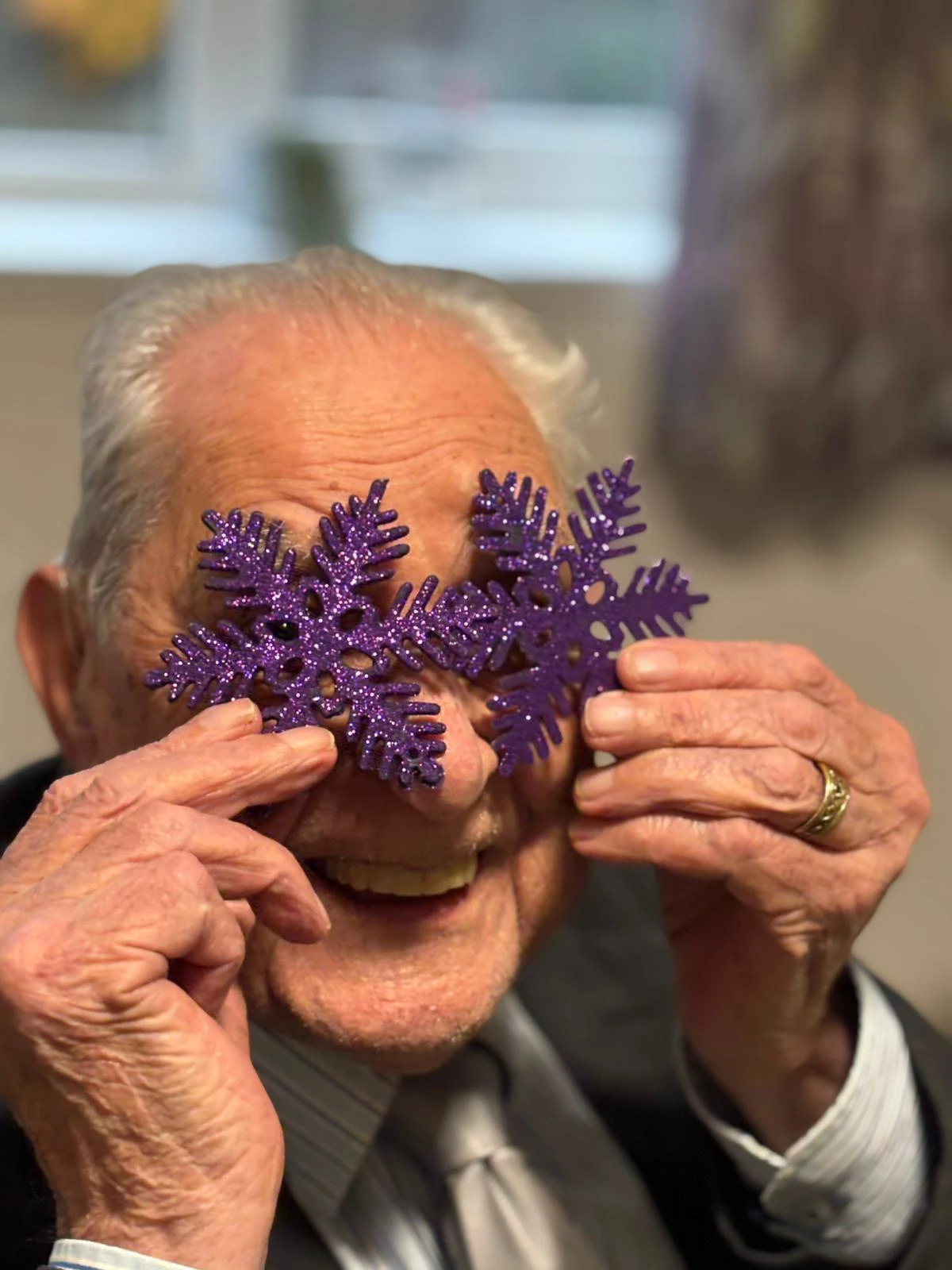 Resident placing xmas decorations over eyes