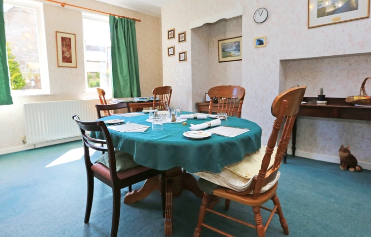A dining table set for dinner