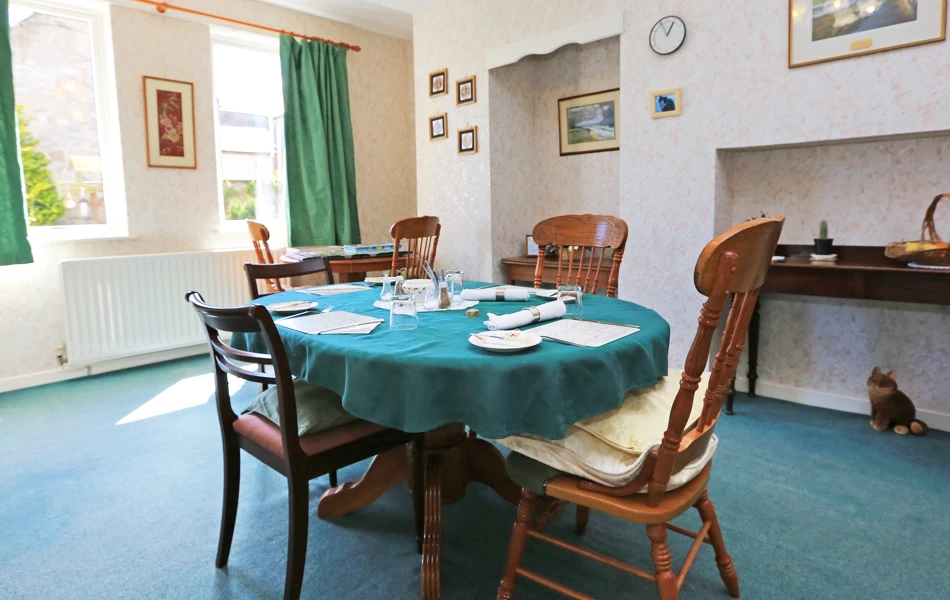 A dining table set for dinner