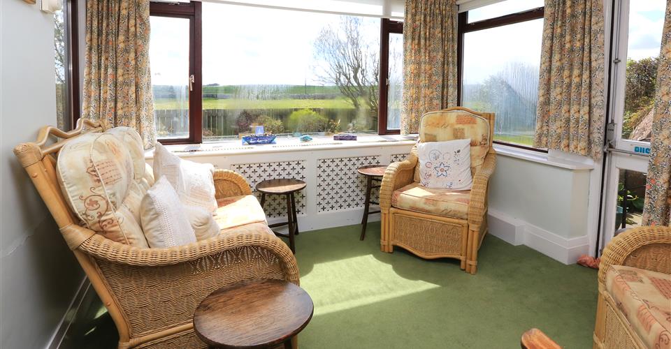 A cosy lounge area with seating for the residents of Armstrong House