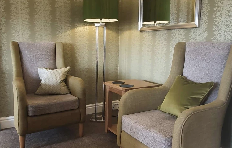 Two chairs in the lounge of Abbeyfield House, Garstang PR3 1PA.jpg