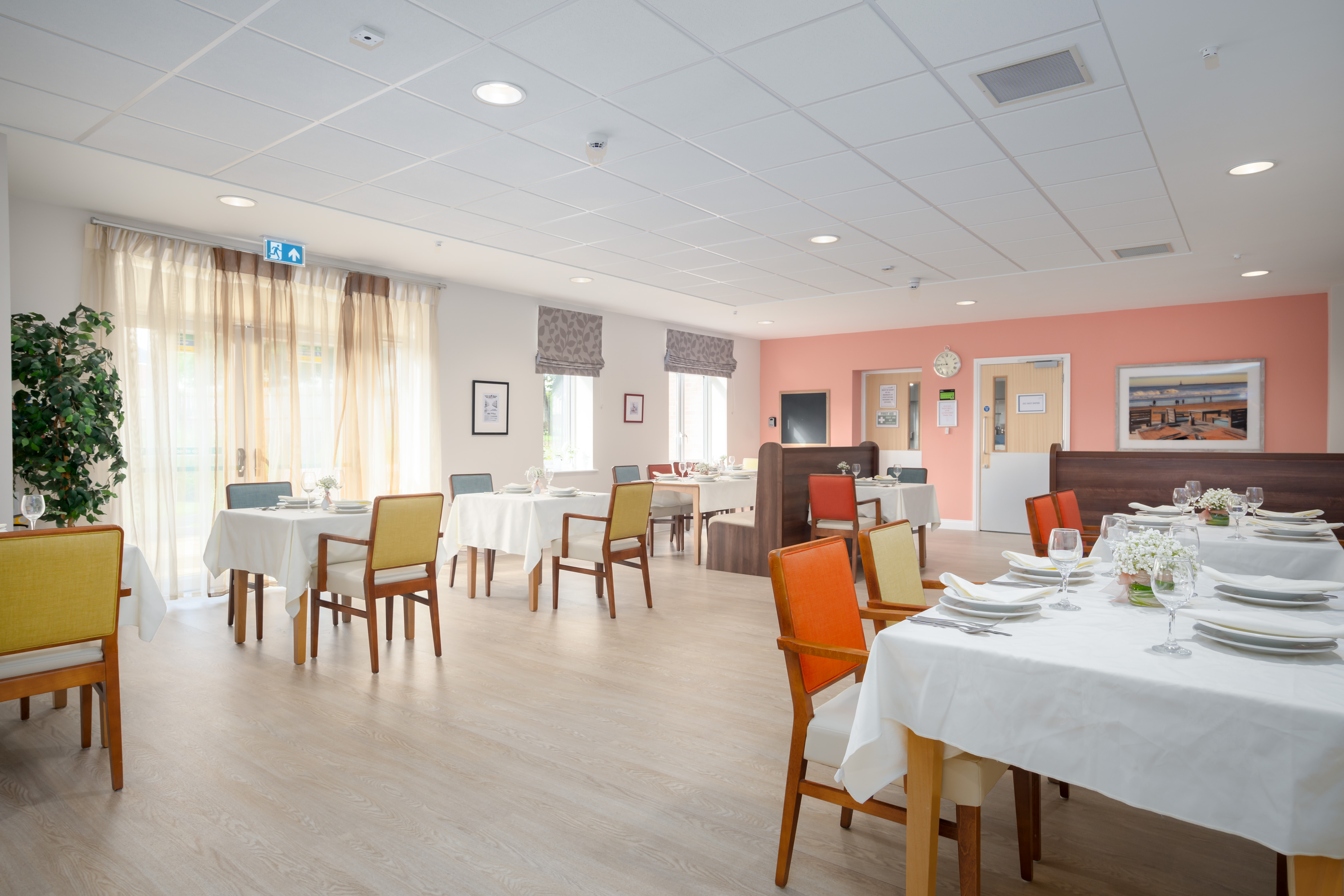 Large windows feature in resident dining room at Hope Bank View