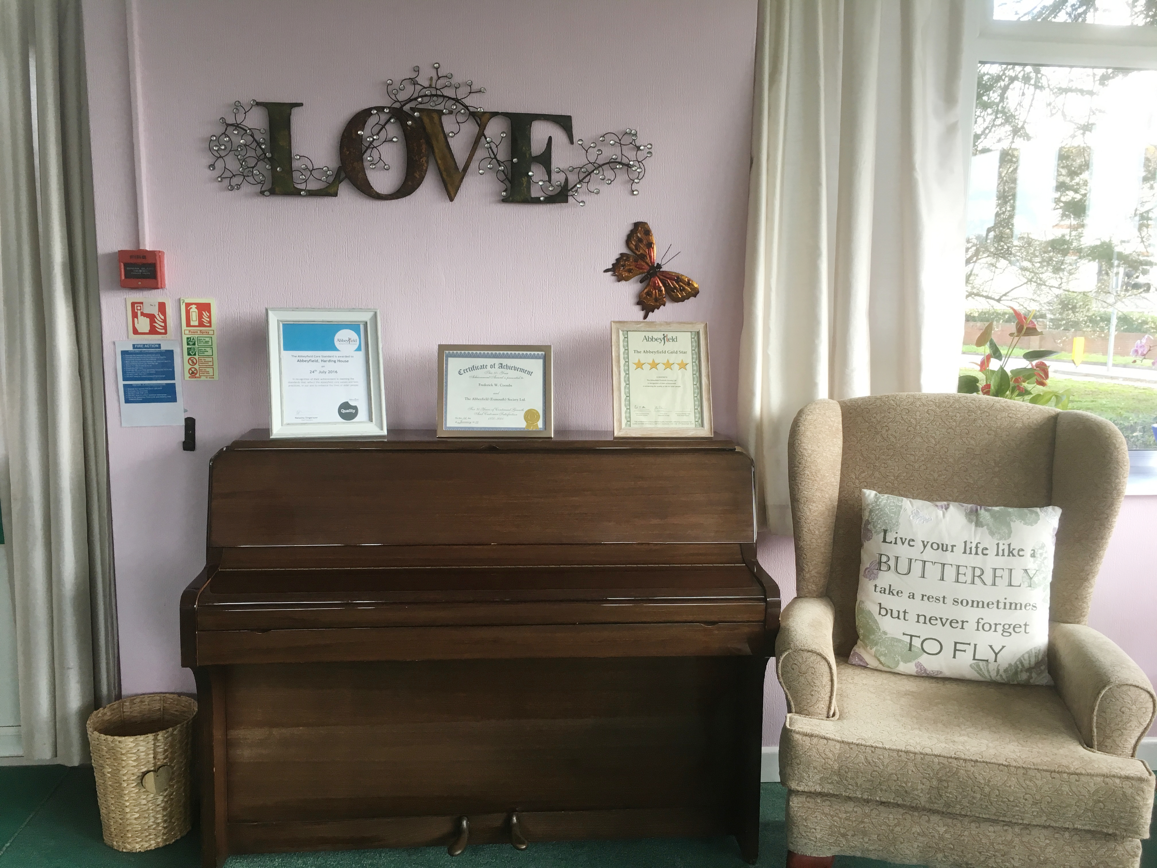 Piano and seat for residents to sit practice at Harding House