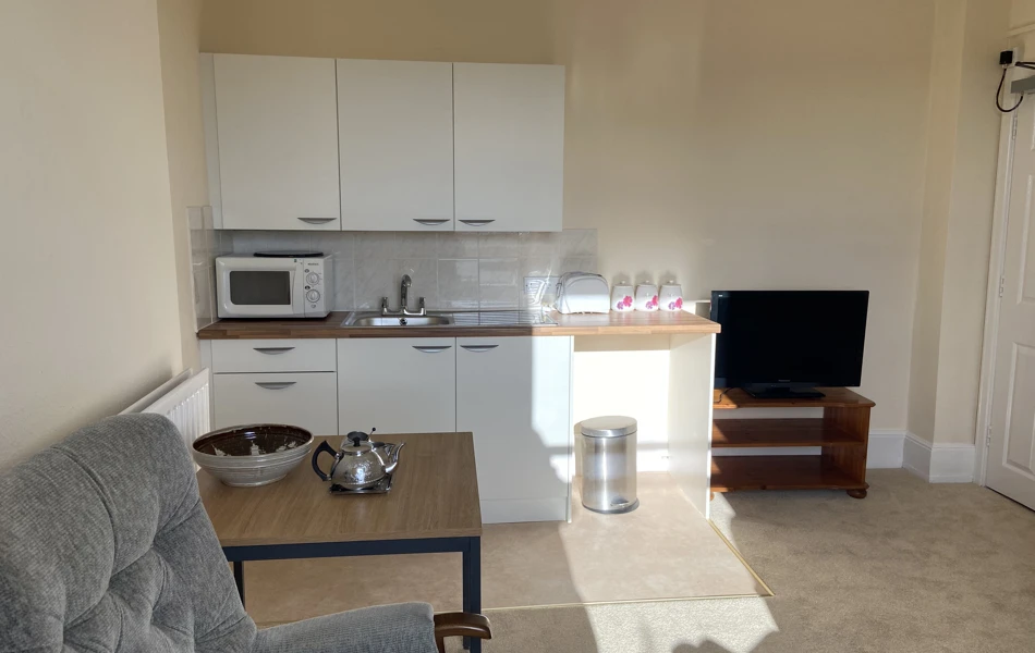 The kitchen area of one of our single rooms