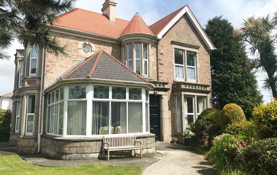 Teveor House has many of its original features such as the tiled entrance and stained glass windows
