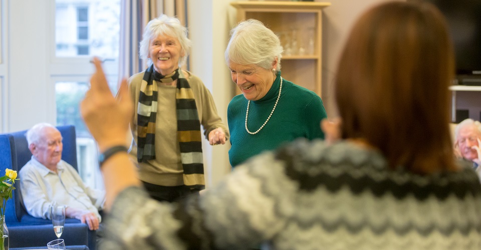 Residents enjoy an activity at Abbeyfield House, Bristol BS6 6YR