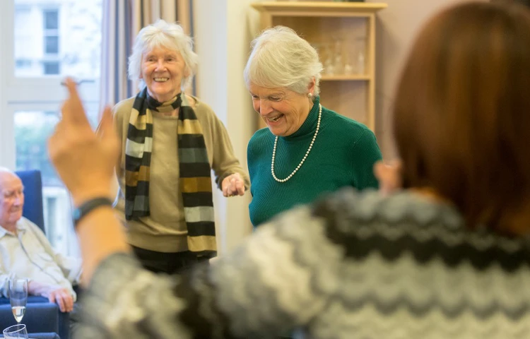 Residents enjoy an activity at Abbeyfield House, Bristol BS6 6YR