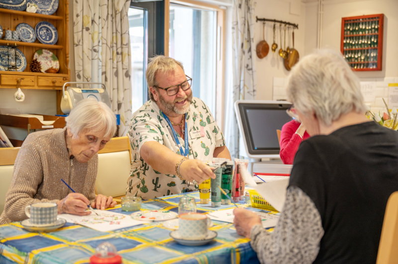 Staff And Residents Doing Some Painting Together