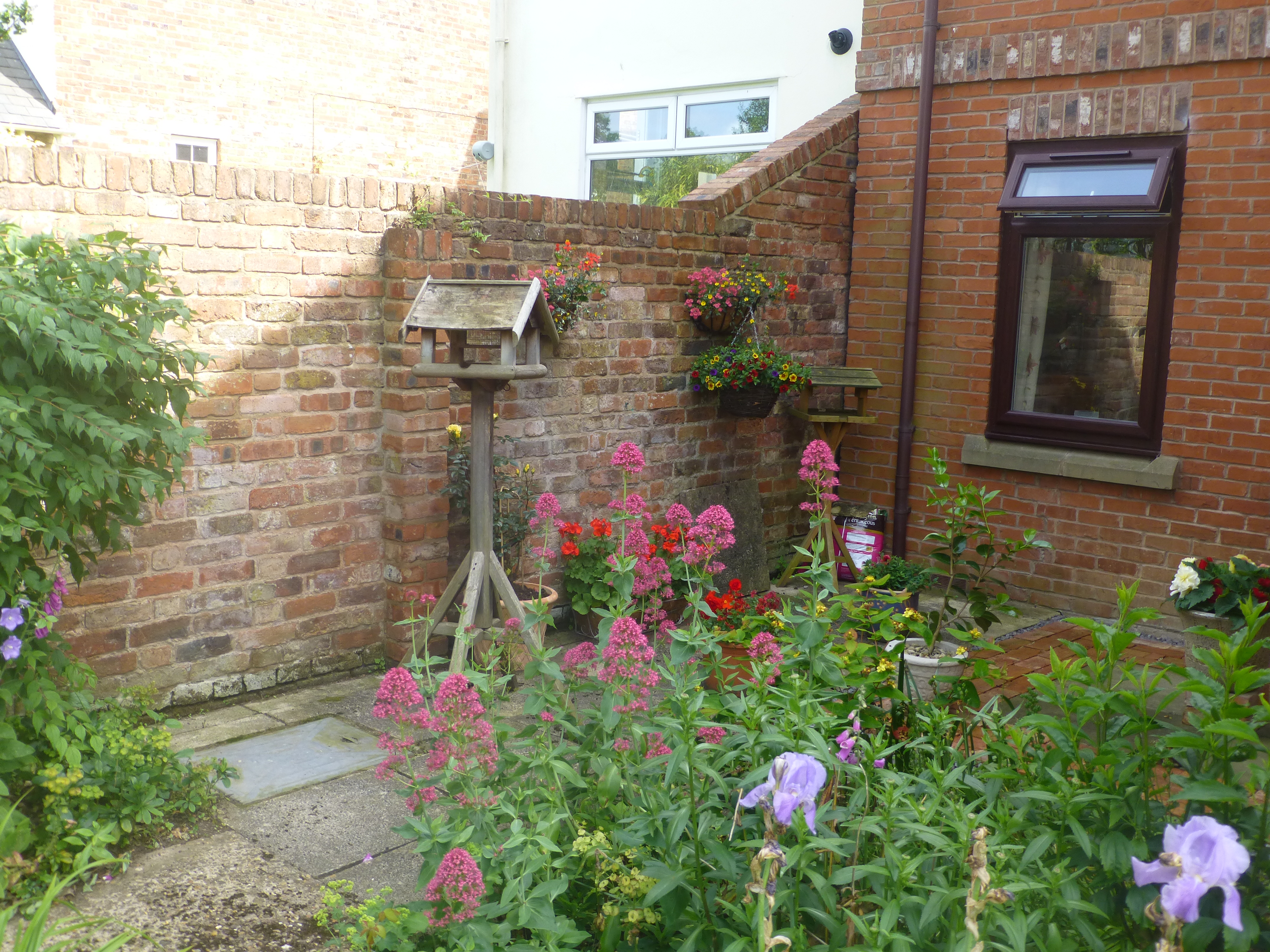 Bird feeder in garden at Prestbury House, Cheltenham GL52 3DD