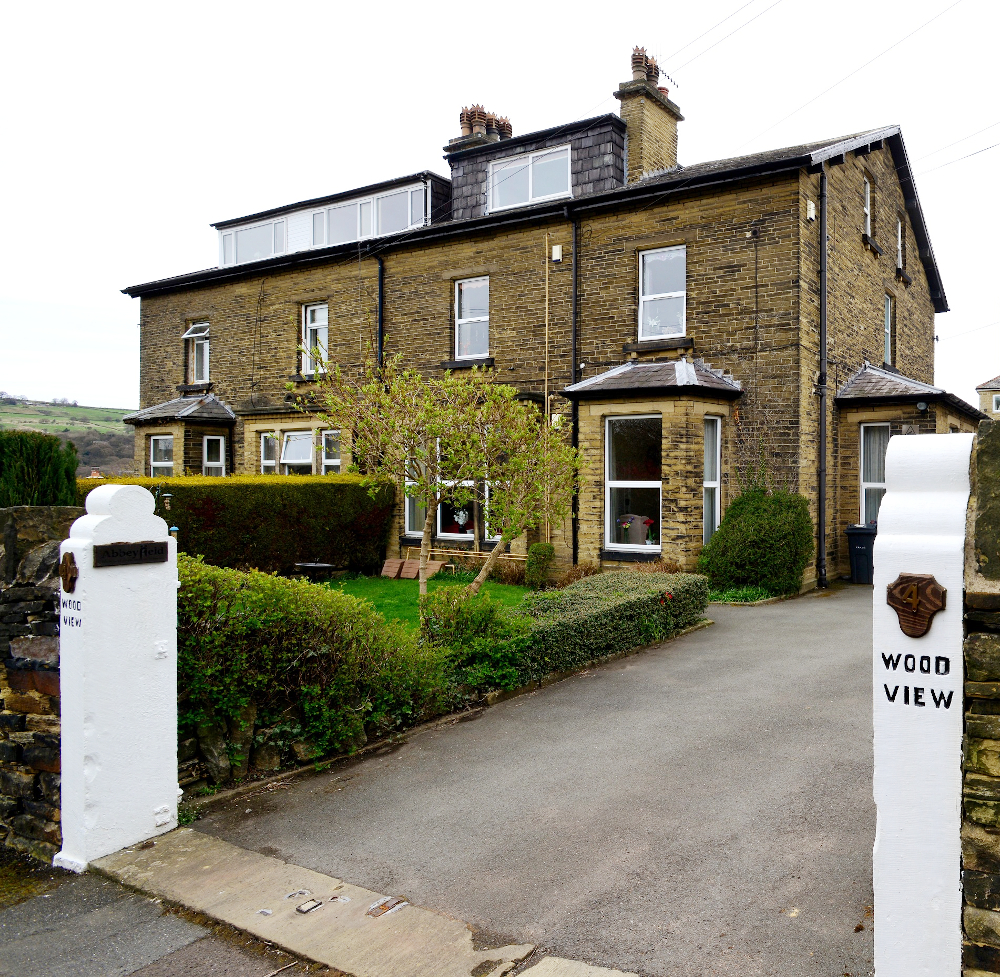 Entrance to Wood View a large stone house
