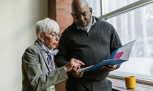 Woman and man looking at a report