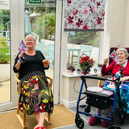 A lady waving a union jack