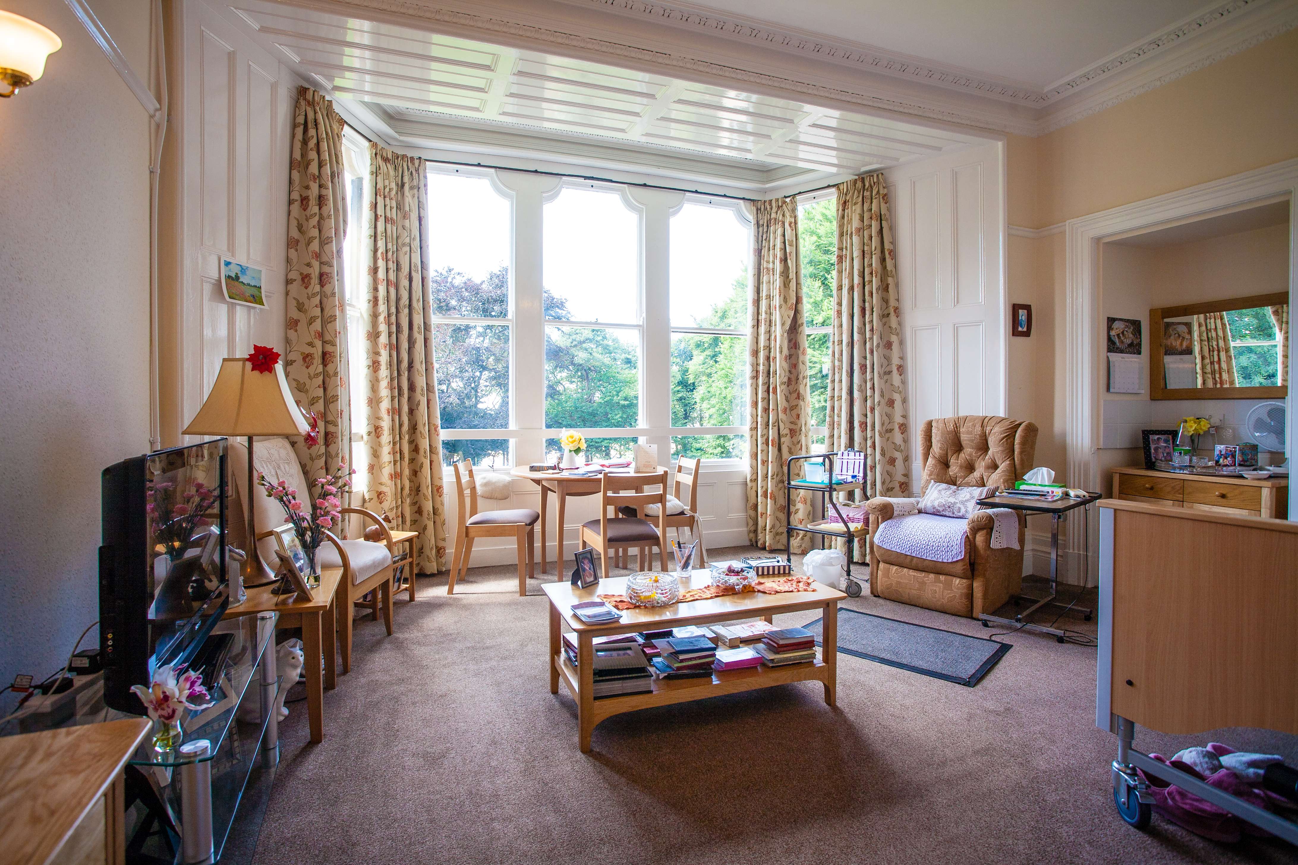 A large bedroom with tall windows at Cove House