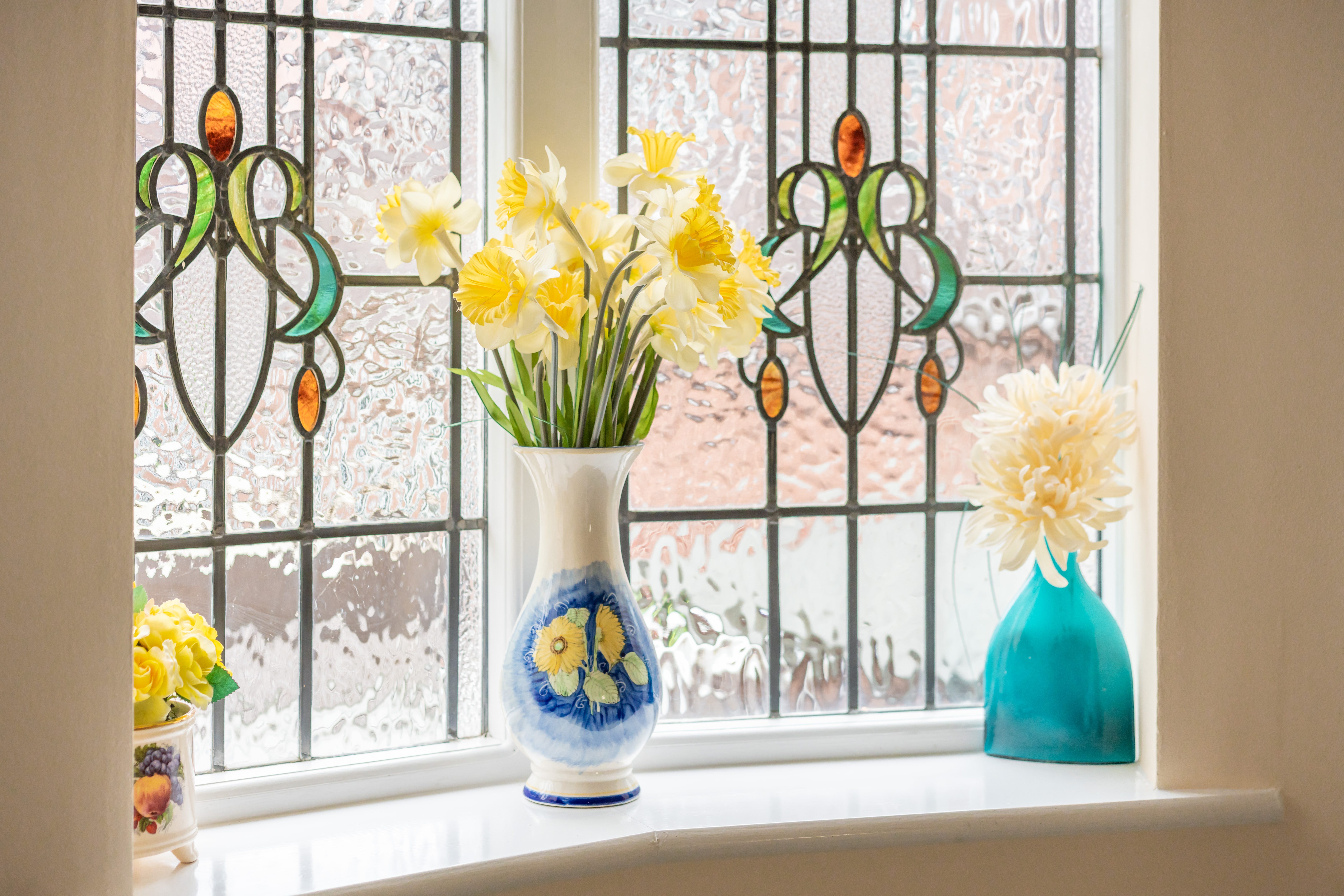 stain-glass-window-with-fresh-flowers-at-middleton-house.jpg