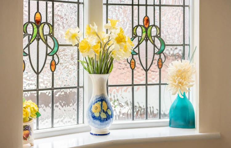stain-glass-window-with-fresh-flowers-at-middleton-house.jpg