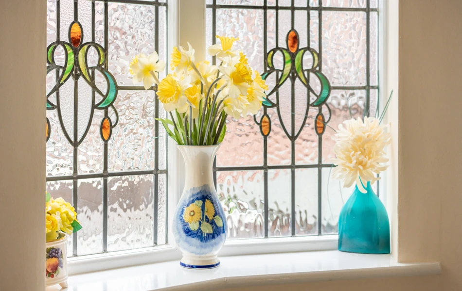 stain-glass-window-with-fresh-flowers-at-middleton-house.jpg