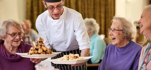 Older people being served a delightful meal