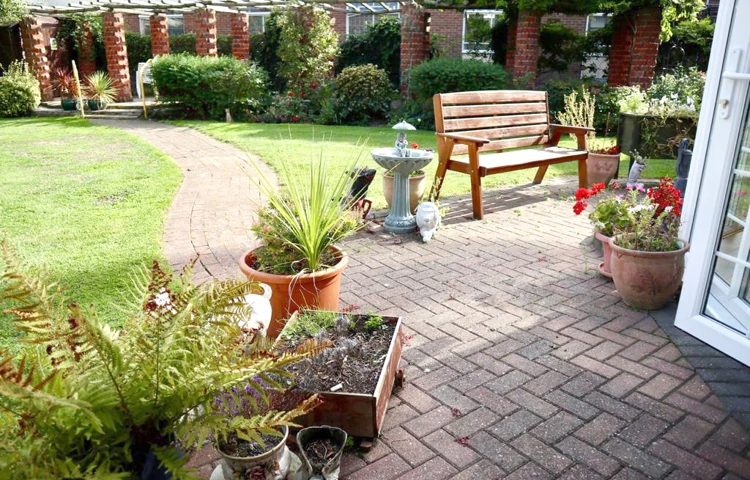 Patio area in the garden where residents can sit and enjoy the sunshine