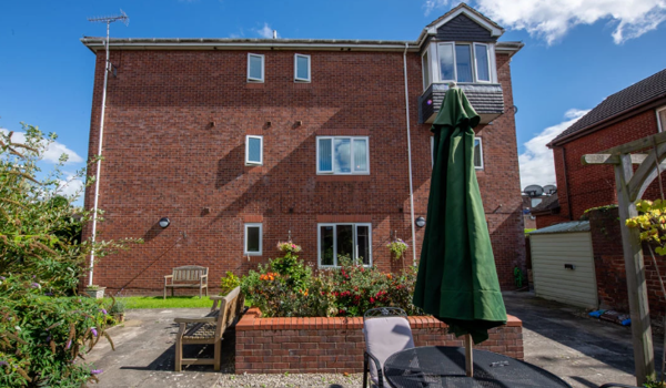 bright-and-sunny-back-garden-at-Abbeyfield House, Flint CH6 5AS