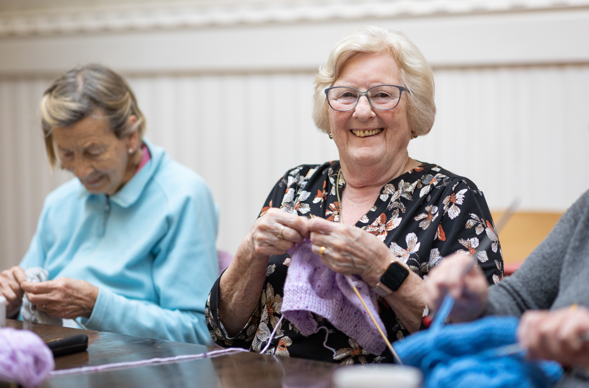 Group Of Happy Older Woman Doing Knitting Together