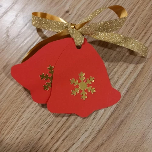 A felt bell with a gold bow