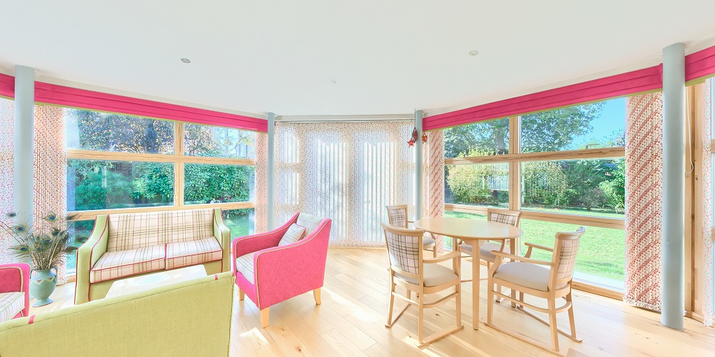 Sunlit seating area for residents to relax in at Winton House