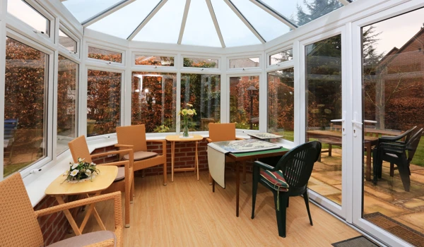 Sit back and relax in our conservatory with view of the garden at Bailey House