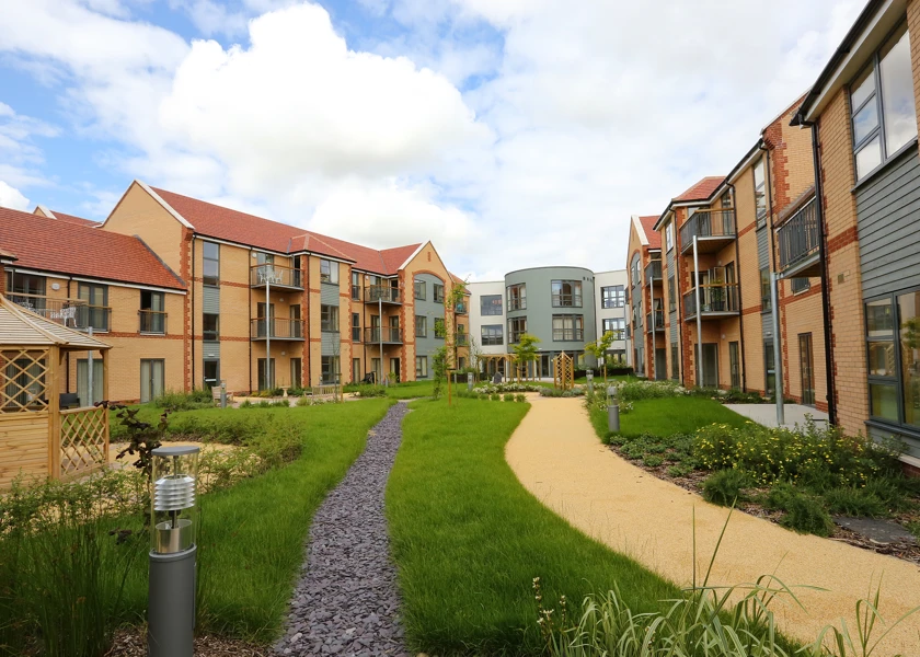 Exterior shot of Girton Green showing the ample, bright grounds where residents can enjoy the sunshine or a breath of fresh air