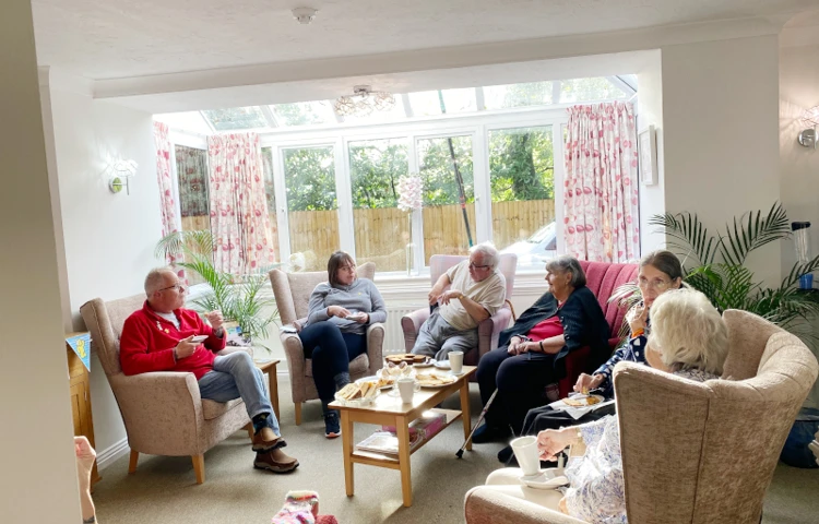 Harleston House Residents Enjoy Spending Time Together Socialising In The Communal Lounge
