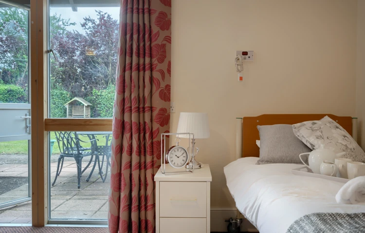 Bedroom with view of the garden at Abbeyfield House, New Malden